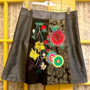 Size 8 whimsical Desigual skirt. Fun and flirty. Unique design.